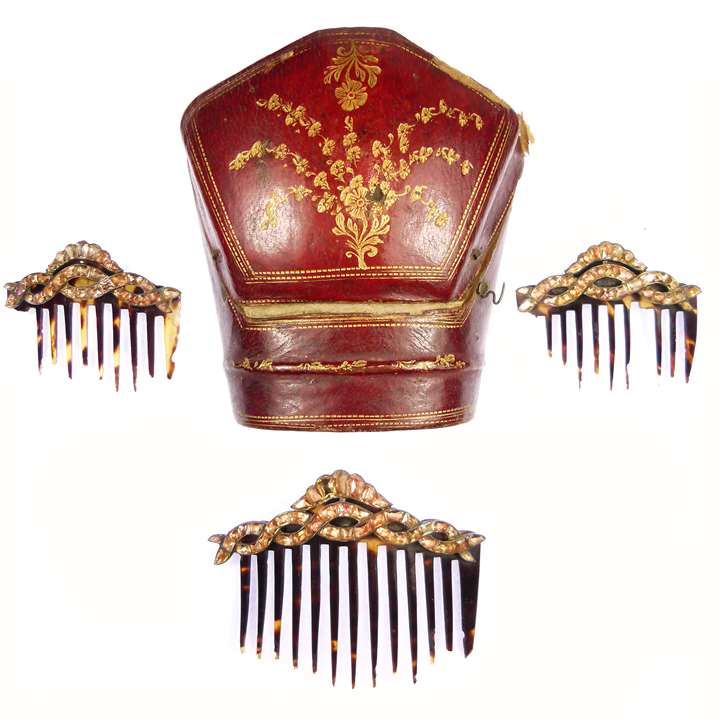 Set of three golden orange topaz graduated hair combs, one large and two small